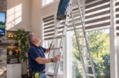 Shutter Outlet installing custom blinds in Toronto home