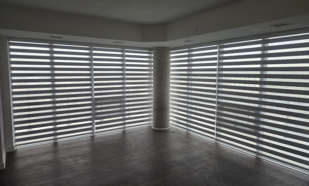 Motorized zebra blinds in a modern open concept Toronto home