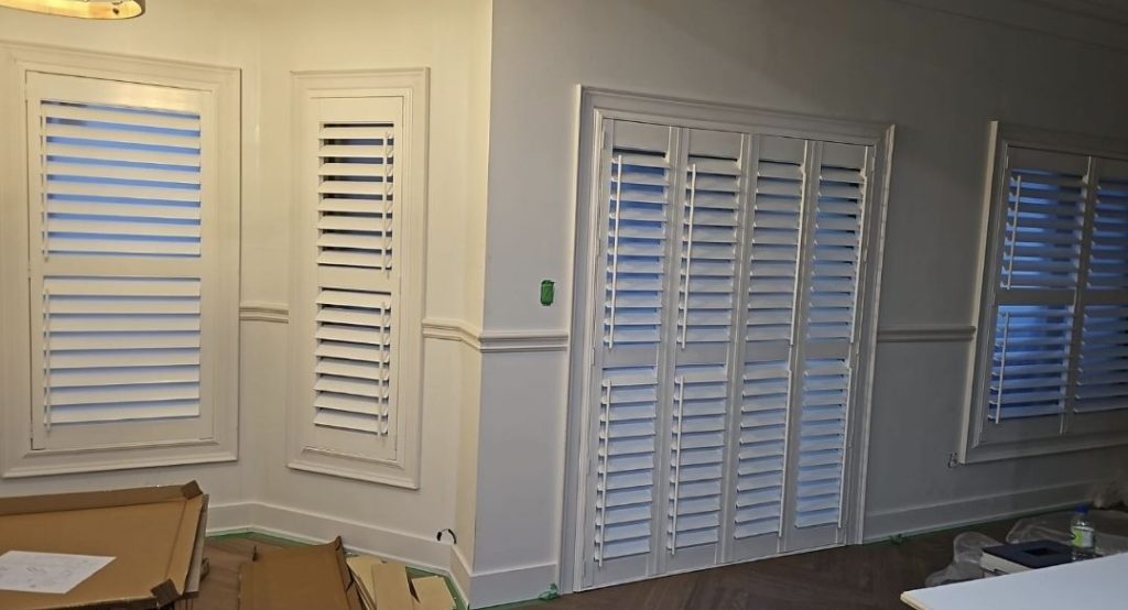 Plantation shutters installed on patio doors in modern home