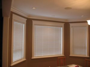 Enhance your home with Faux Wood Blinds from Shutter Outlet