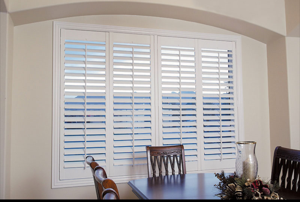 White custom California shutters installed in an Ontario living room