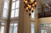 a chandelier hanging from the ceiling of a living room