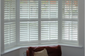 Bay window with white vinyl shutters in Toronto and Southern Ontario.