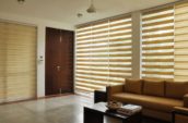 Modern living room in Vaughan featuring custom shutters and blinds by Shutter Outlet.